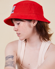 Big Bud Bucket Hat in mustang red worn by Hana