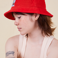 Big Bud Bucket Hat in mustang red worn by Hana