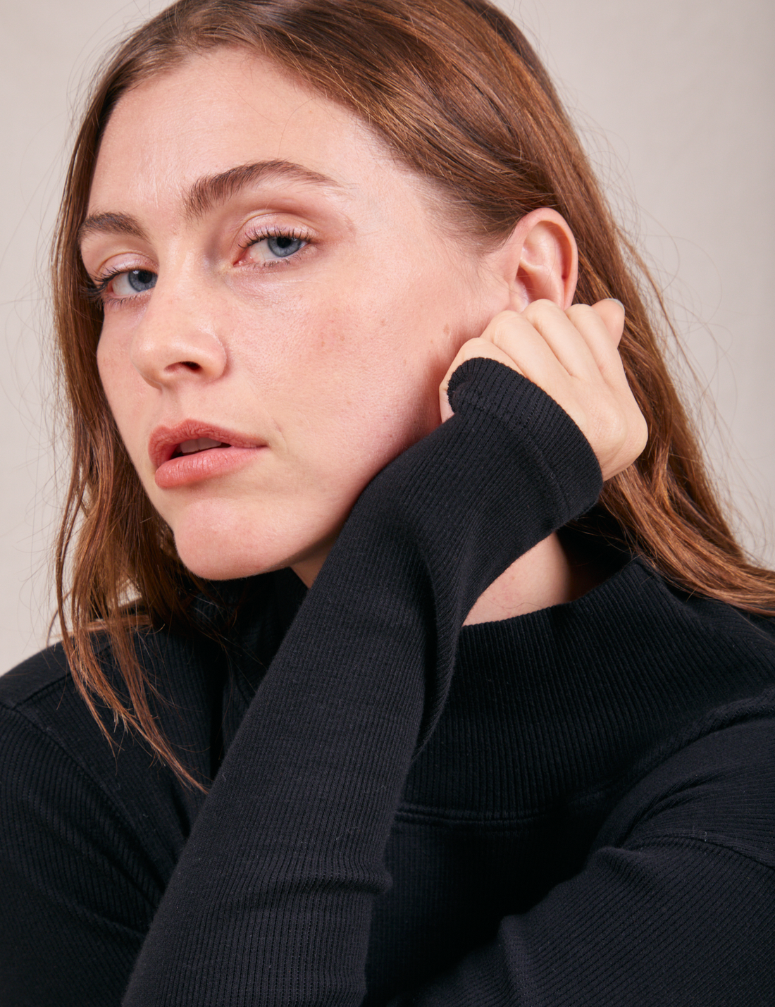 Allison is wearing Essential Turtleneck in Basic Black