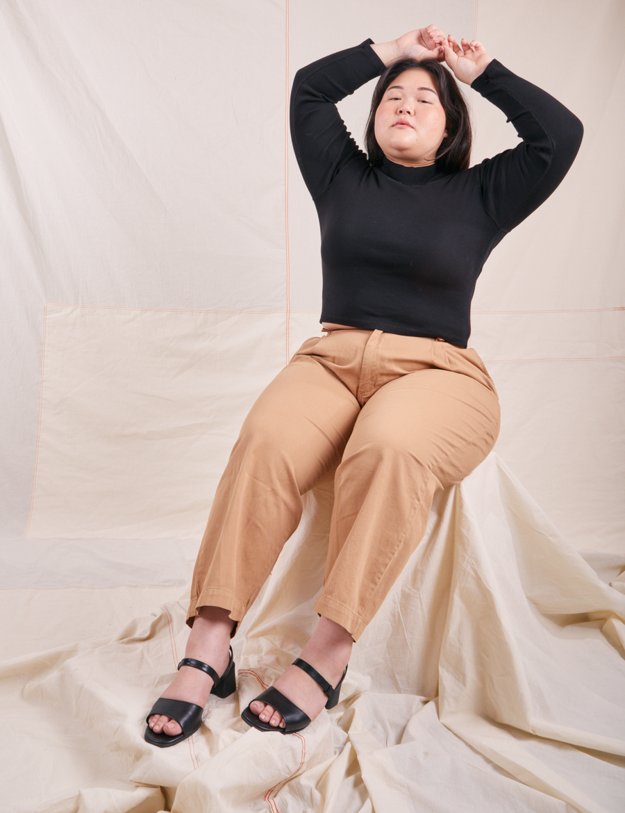 Ashley is wearing Essential Turtleneck in Basic Black