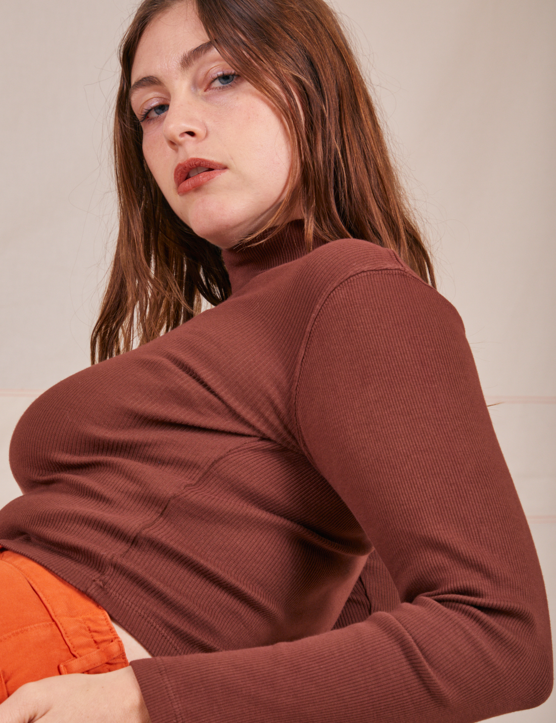 Side view of Essential Turtleneck in Fudgesicle Brown worn by Allison