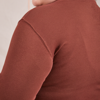 Side close up of Essential Turtleneck in Fudgesicle Brown on Ashley