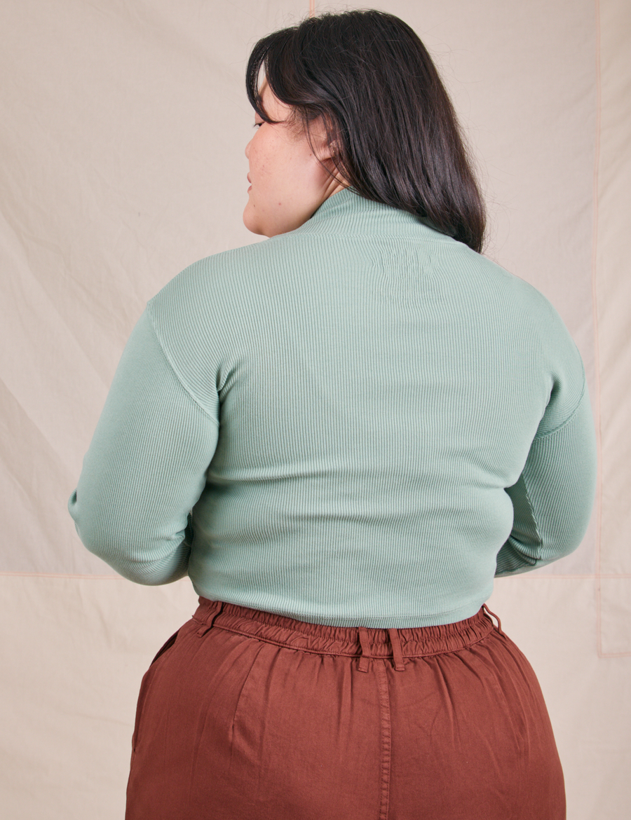 Back view of Essential Turtleneck in Sage Green worn by Ashley