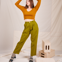 Long Sleeve V-Neck Tee in Spicy Mustard on Allison wearing olive green trousers