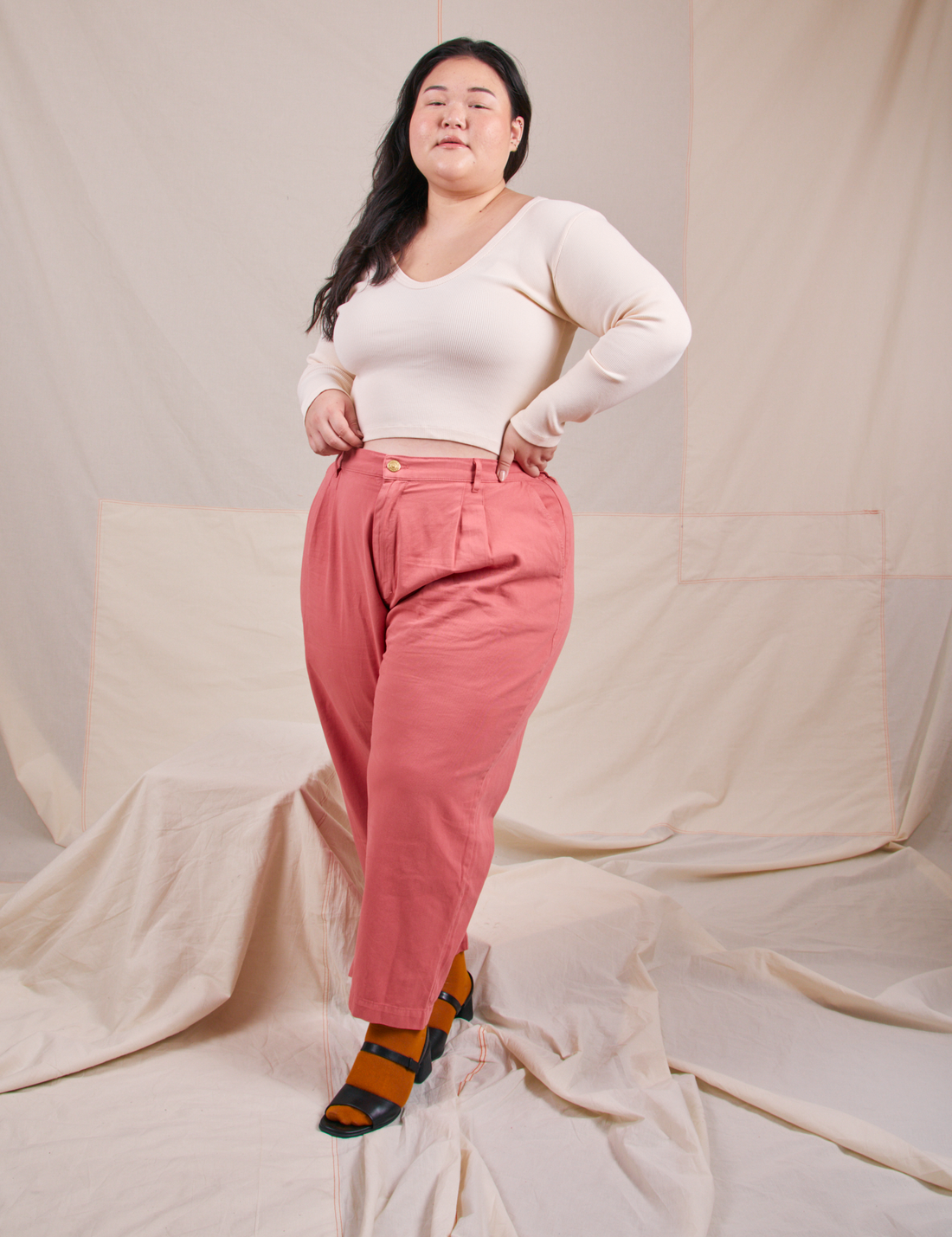 Ashley is wearing Long Sleeve V-Neck Tee in Vintage Tee Off-White