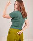 Back view of Fisherman Polo in Dark Emerald Green worn by Allison