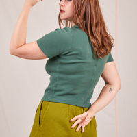Back view of Fisherman Polo in Dark Emerald Green worn by Allison
