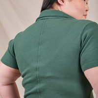 Back view of Fisherman Polo in Dark Emerald Green worn by Ashley