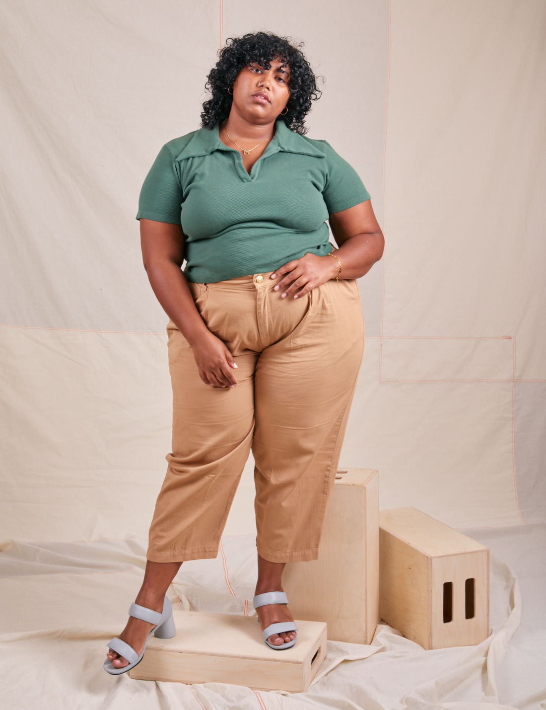 Morgan is wearing XL Fisherman Polo in Dark Emerald Green