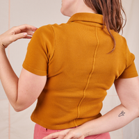 Back view of Fisherman Polo in Spicy Mustard worn by Allison