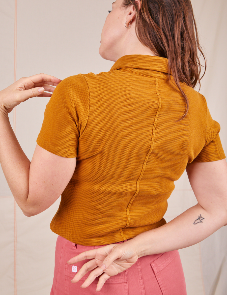 Back view of Fisherman Polo in Spicy Mustard worn by Allison