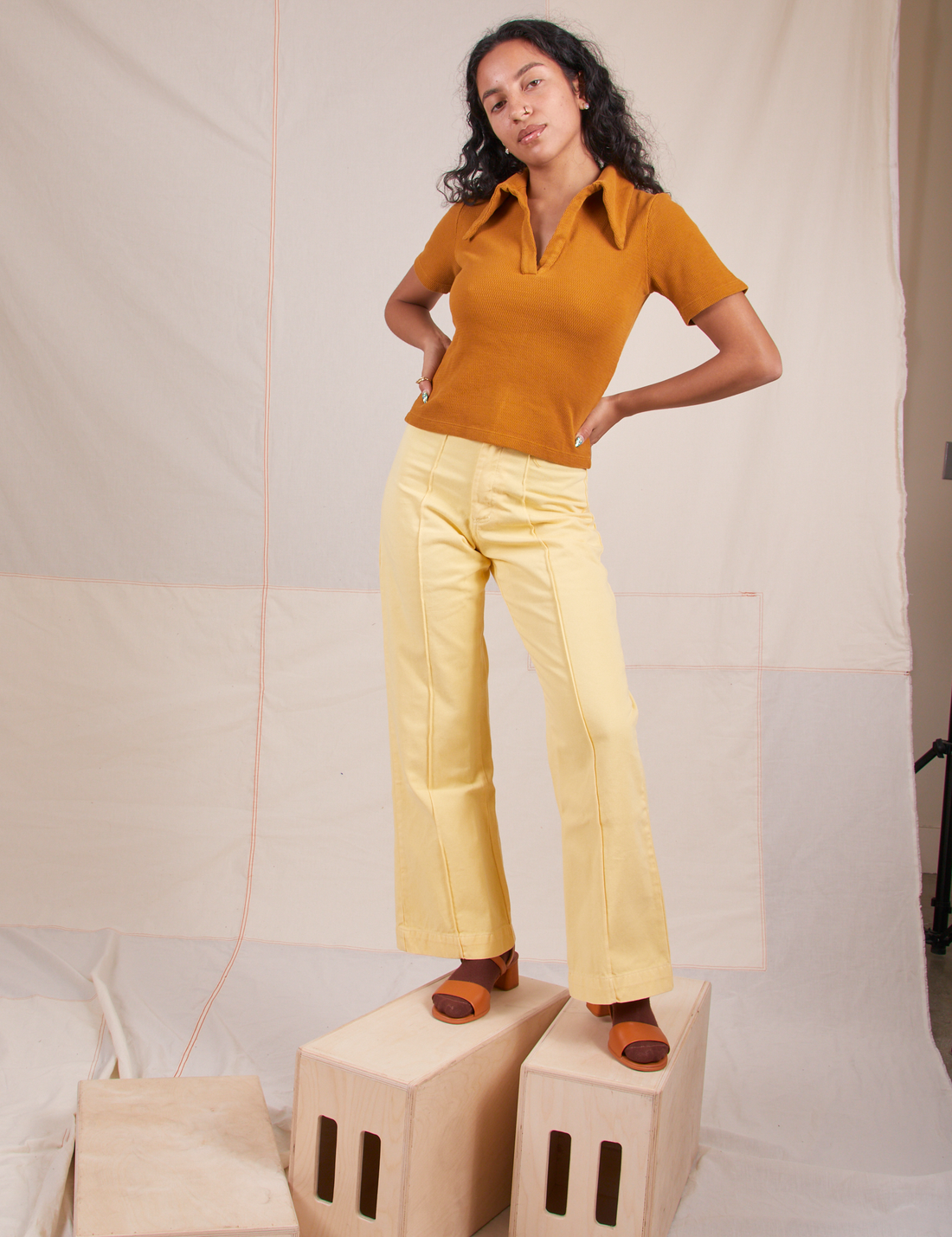 Blair is wearing Fisherman Polo in Spicy Mustard