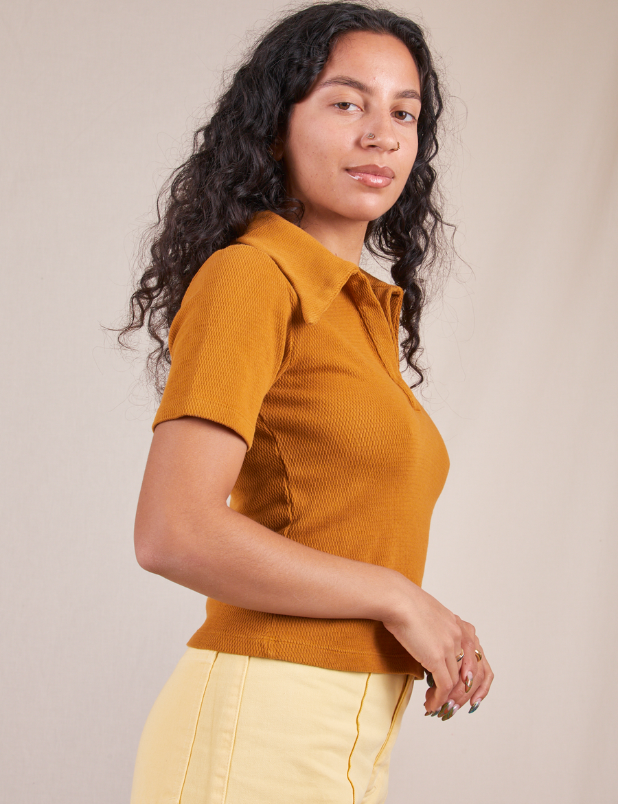 Side view of Fisherman Polo in Spicy Mustard worn by Blair