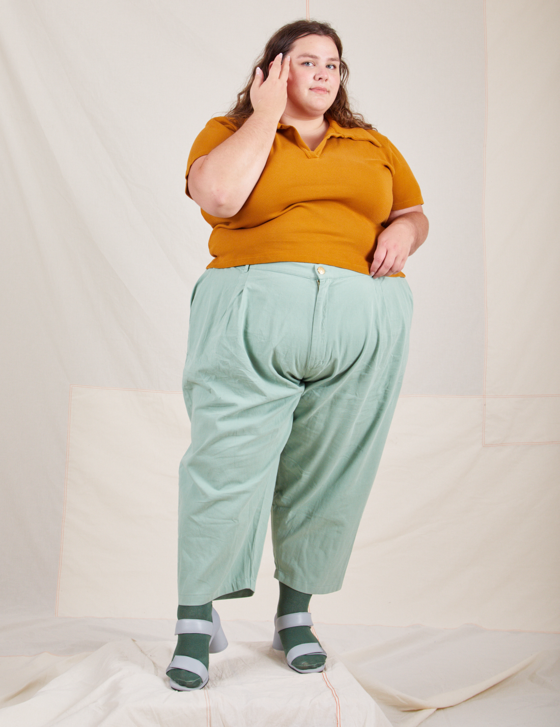 Mara is wearing Fisherman Polo in Spicy Mustard