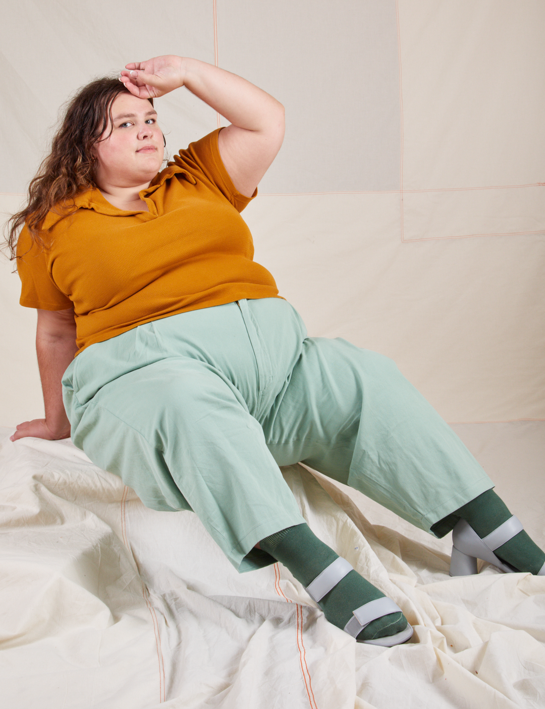 Mara is wearing Fisherman Polo in Spicy Mustard