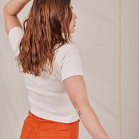 Angled back view of Fisherman Polo in Vintage Tee Off-White worn by Allison