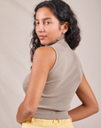 Angled back view of Sleeveless Essential Turtleneck in Khaki Grey worn by Blair