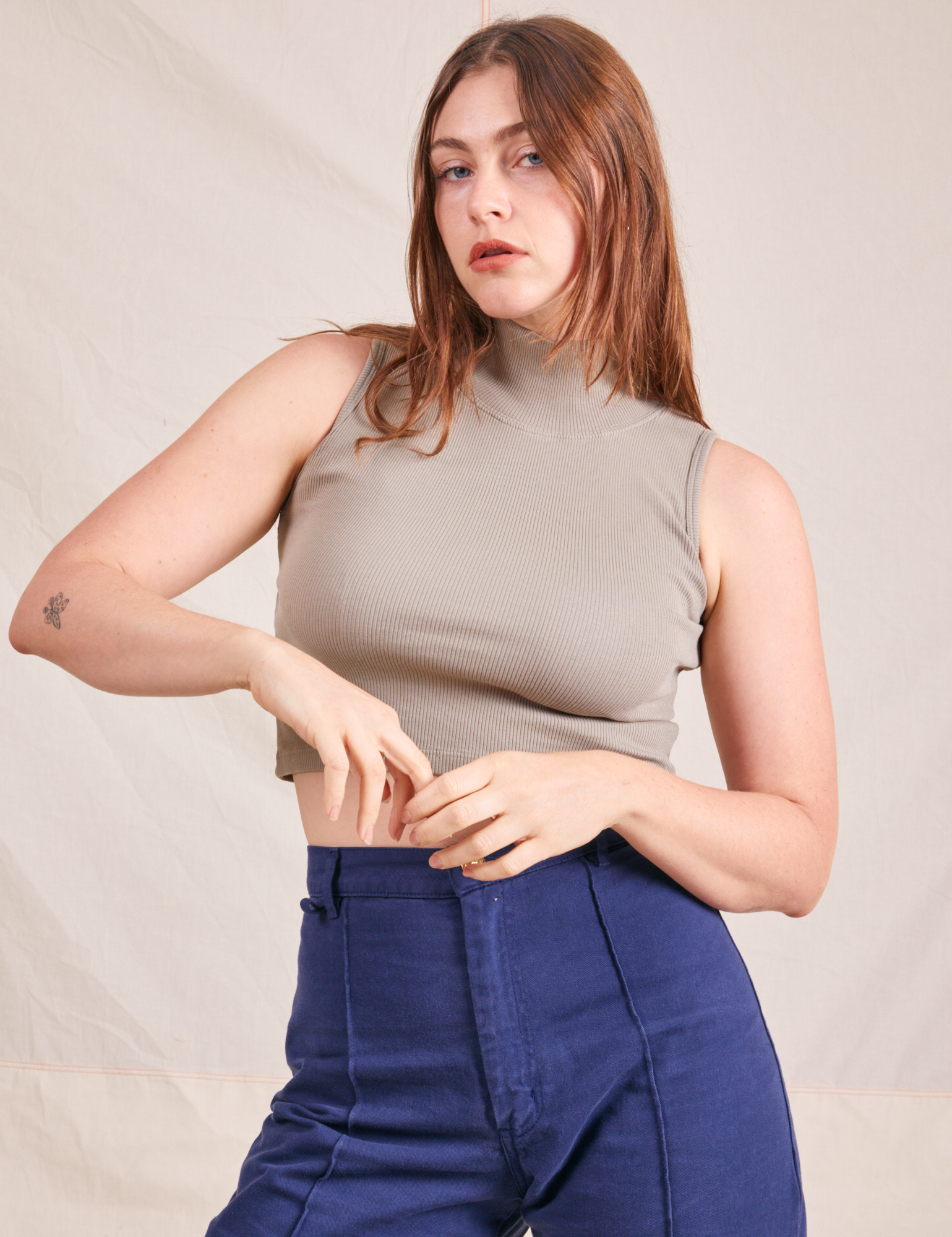 Allison is wearing XXS Sleeveless Essential Turtleneck in Khaki Grey