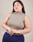 Ashley is wearing L Sleeveless Essential Turtleneck in Khaki Grey