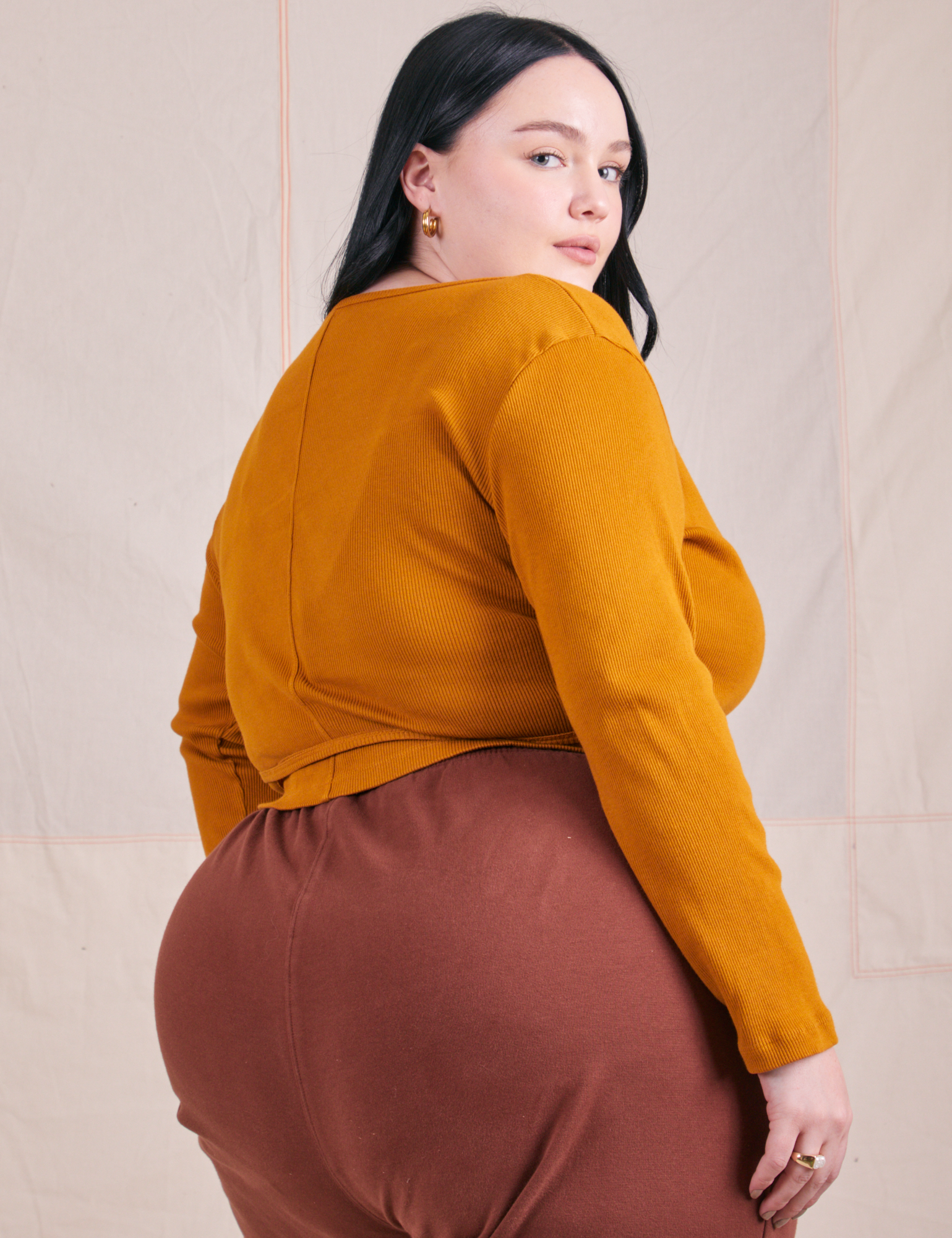 Wrap Top in Spicy Mustard angled back view on Kenna