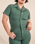 Short Sleeve Jumpsuit in Dark Emerald Green front close up of pockets