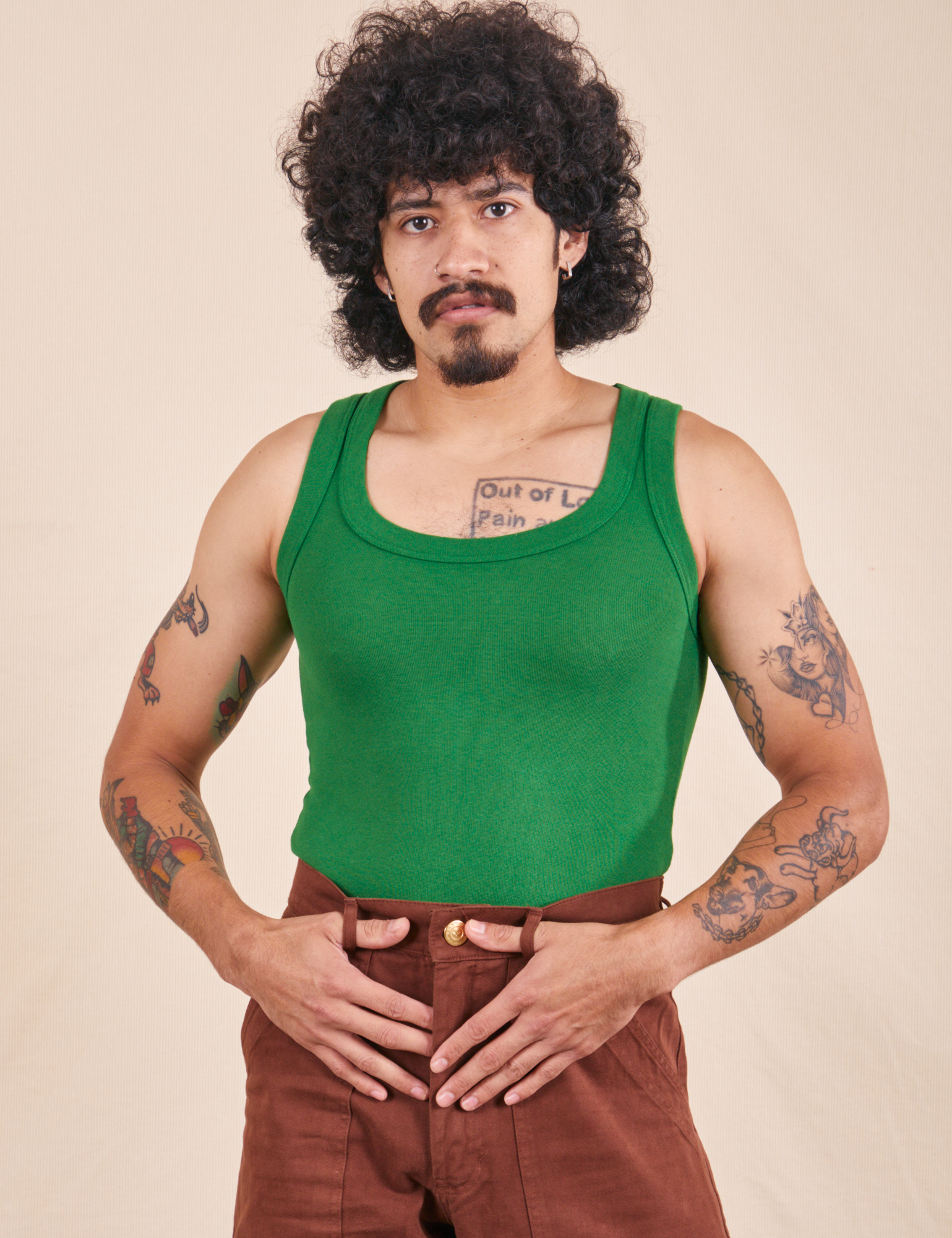 Jesse is wearing XS Tank Top in Forest Green