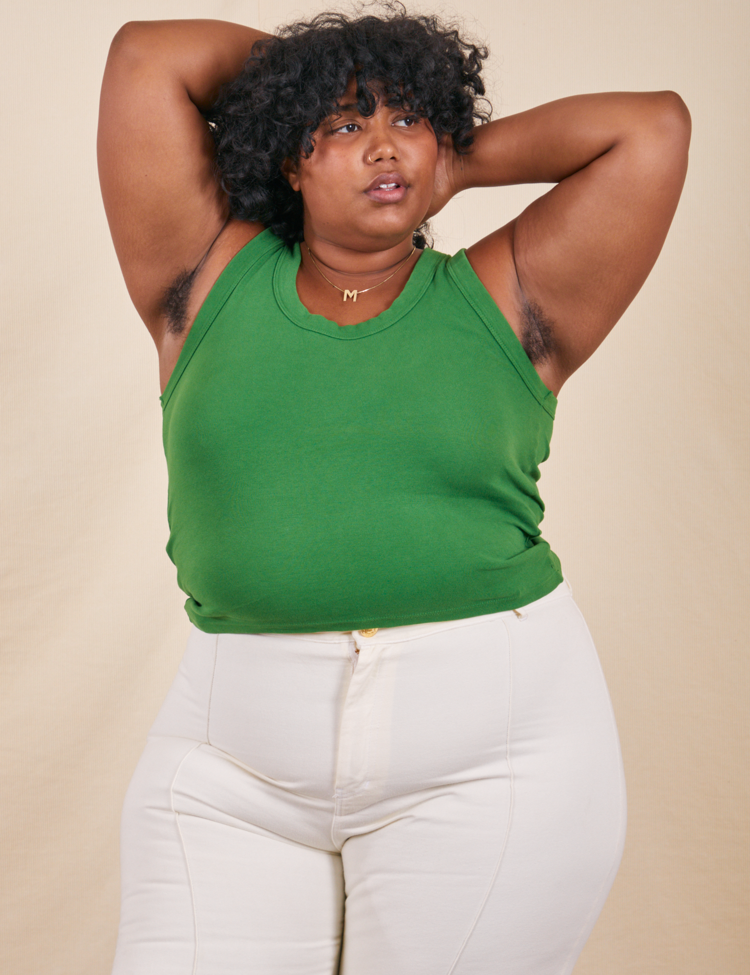 Morgan is wearing Tank Top in Forest Green