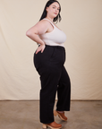 Side view of Work Pants in Basic Black and vintage off-white Tank Top on Kenna