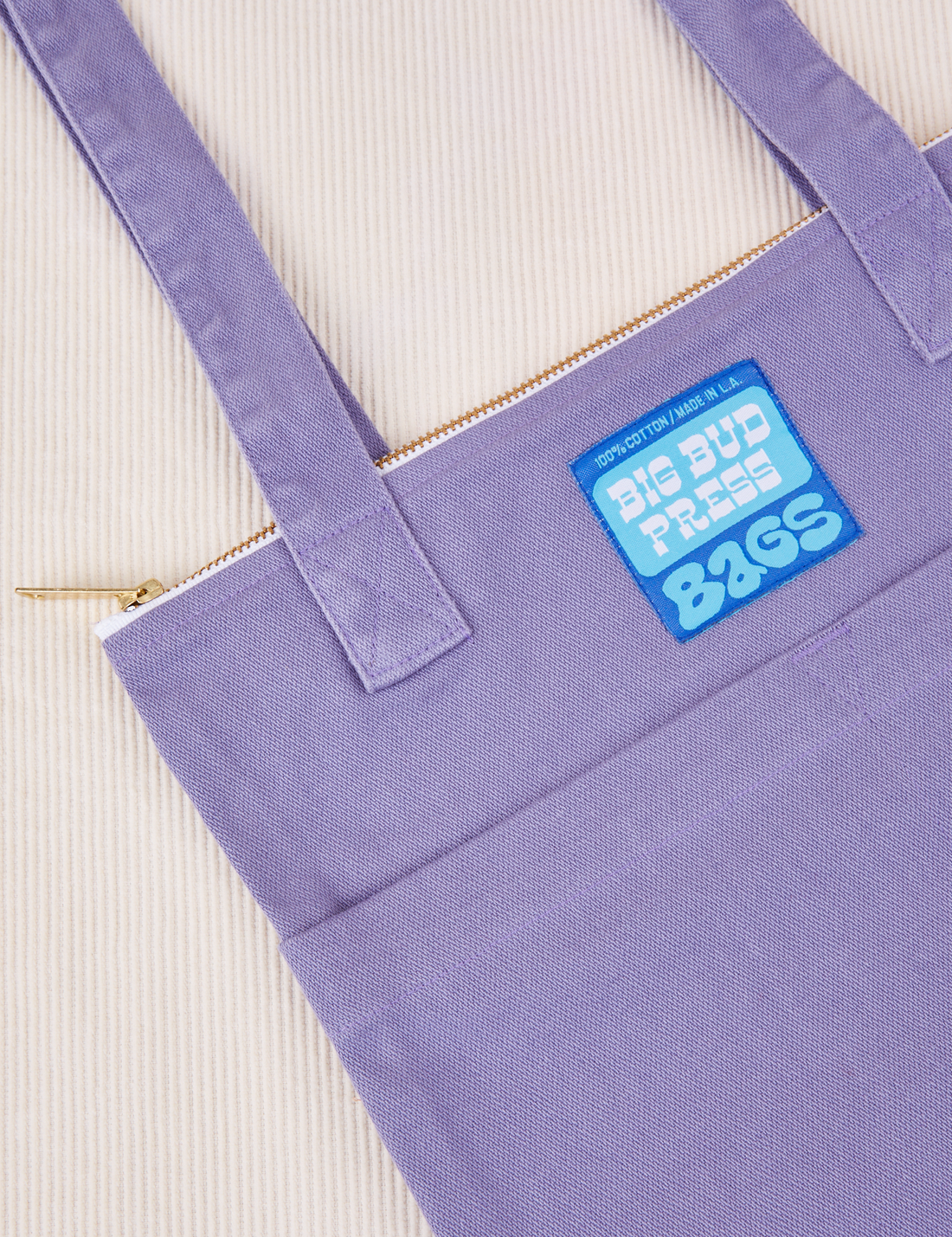 Over-Shoulder Zip Mini Tote in Faded Grape with blue Big Bud press label